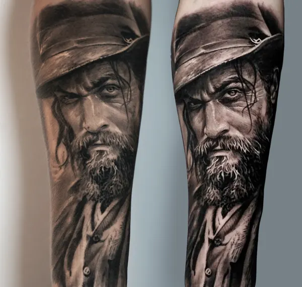 The same black and grey portrait on the forearm, fresh and healed, side by side.